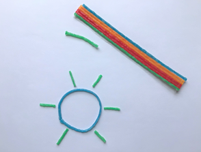 Flexible, waxy sticks that adhere to a variety of surfaces and can be removed without leaving any residue. The waxed yarn featured in the above picture is Wikki Stix produced by Omnicor, Inc.