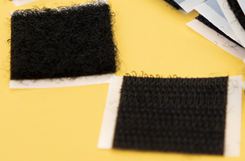 Two types of fabric that mesh when pressed together. The “loop” fabric is soft and the “hook” fabric is rough.